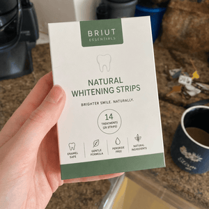 Customer photo holding Briut whitening strips box